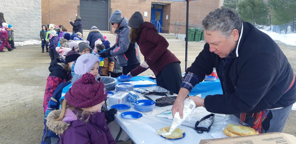 Student in line to get maple syrup goods