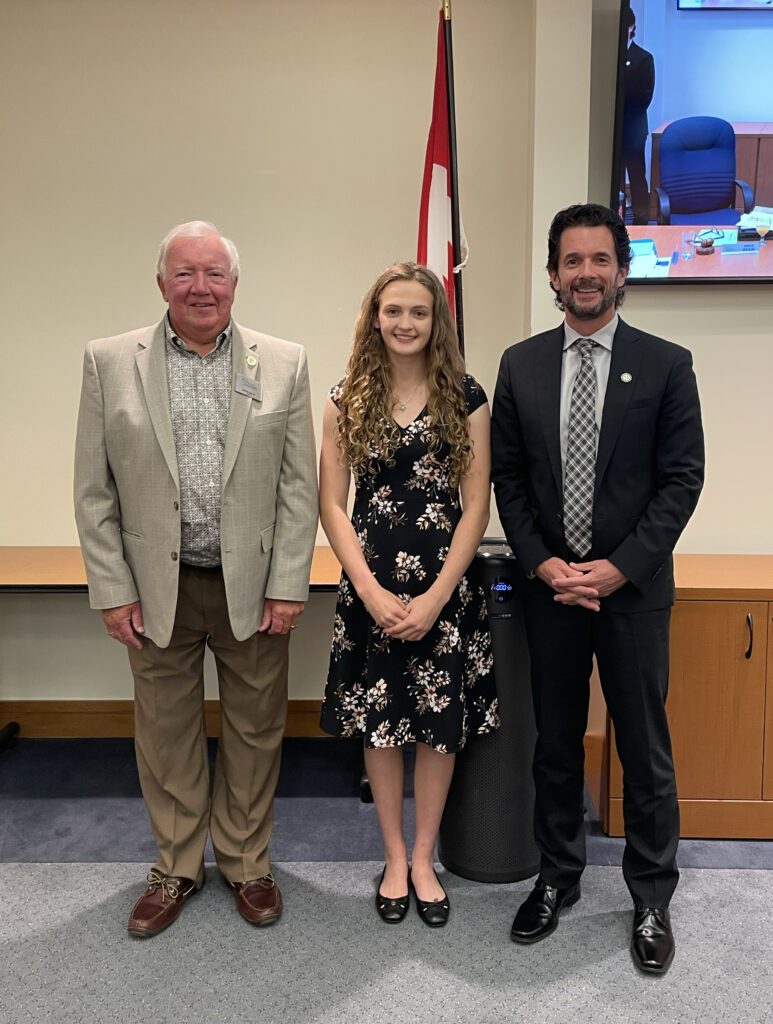 Photo of new student trustee with Chair of the Board and Director of Education